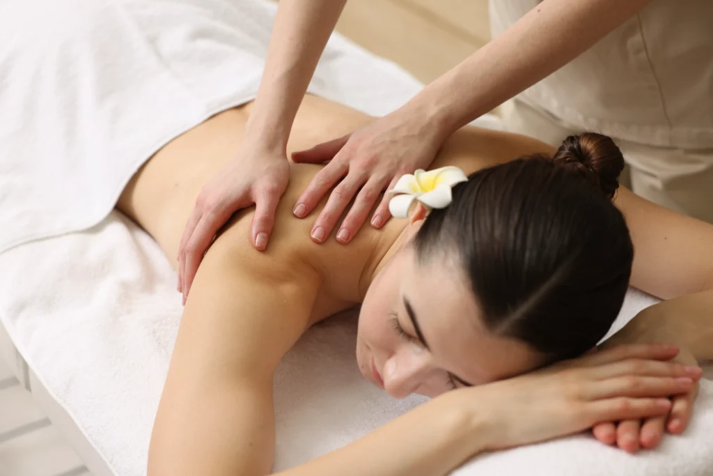 Woman receiving a Swedish back massage at our spa